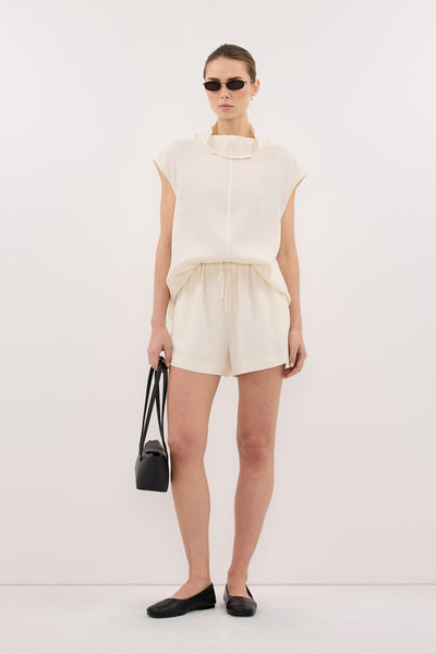 Stas wearing CALIA CREAM DRAWSTRING SHORT
