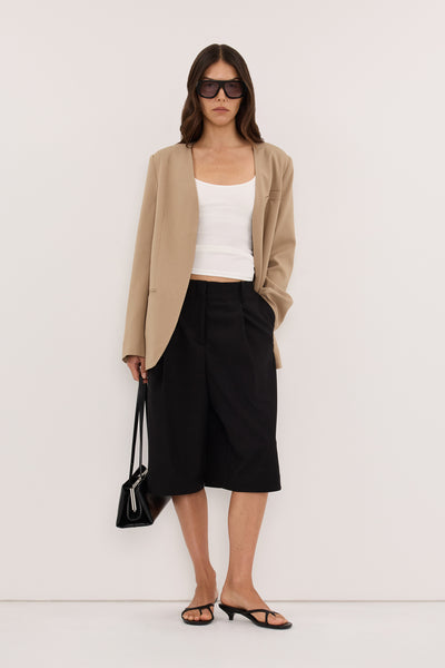 Helena  wearing ROMY BLACK LONGLINE BERMUDA SHORT
