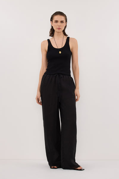 Stas wearing GINNY BLACK RAMIE PANT
