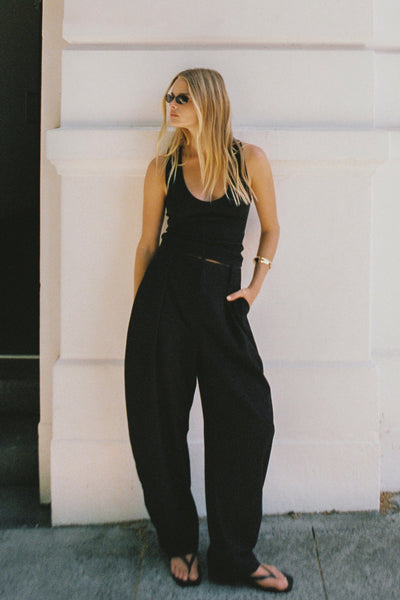 Zoe wearing ROMY BLACK BARREL LEG TAILORED PANT