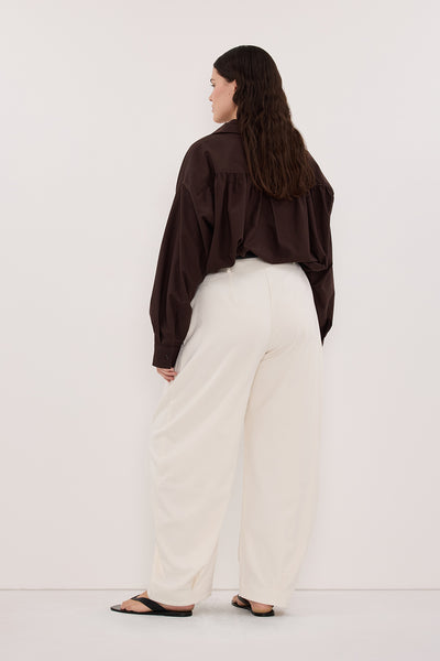 Jasmine wearing ROMY CREAM BARREL LEG TAILORED PANT