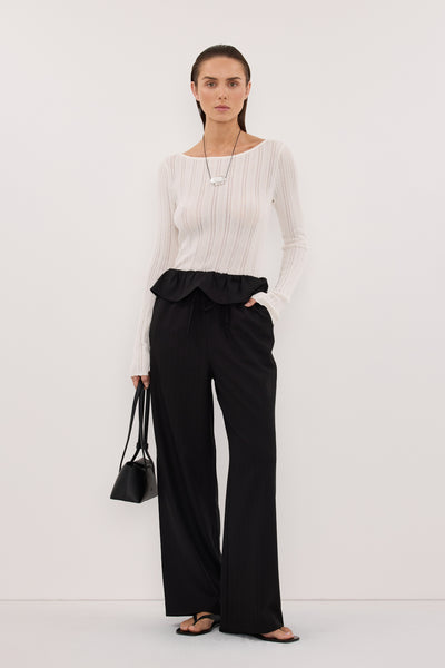 Stas wearing CYRUS BLACK FISHERMAN PANT