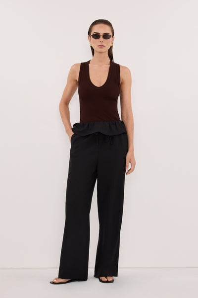 Stas wearing CYRUS BLACK FISHERMAN PANT