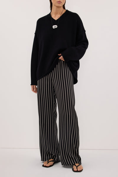Stas wearing ADRIENNE BLACK STRIPE SILK PANT