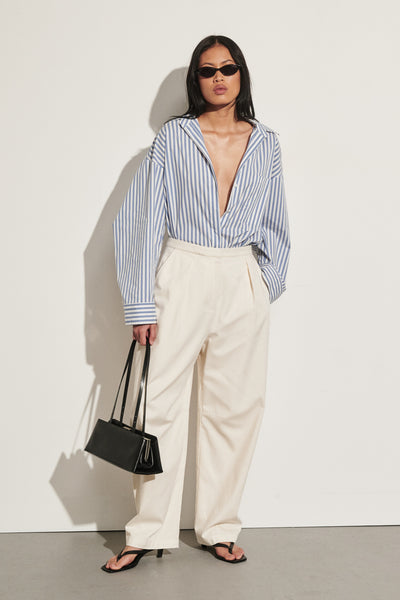 Ploy wearing CAMILLE CREAM TWILL BARREL LEG PANT