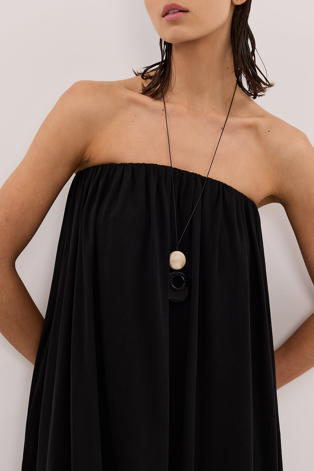 Ava Strapeless Midi Dress in Black By DISSH Ava Strapeless Midi Dress in Black By DISSH