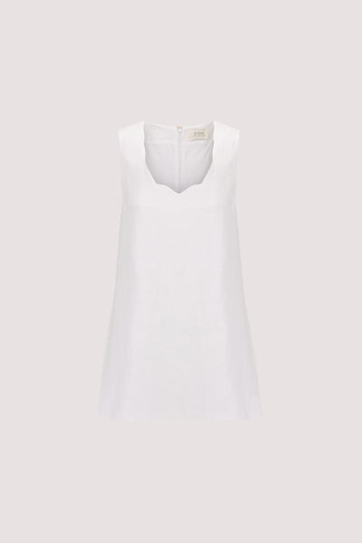 Zoe wearing LELA WHITE SLEEVELESS LINEN MINI DRESS