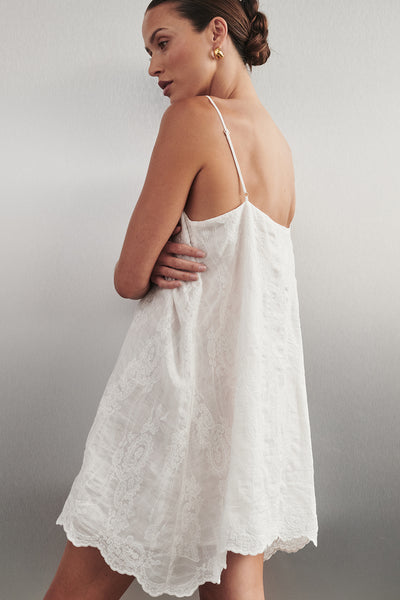 Casey wearing CORDELIA WHITE RAMIE MINI DRESS