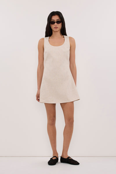 Zoey wearing AURELI NATURAL LINEN MINI DRESS