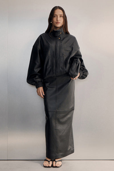 Casey wearing COOPER BLACK LEATHER MIDI SKIRT