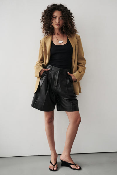Carol wearing MAYFAIR BLACK LEATHER BERMUDA SHORT