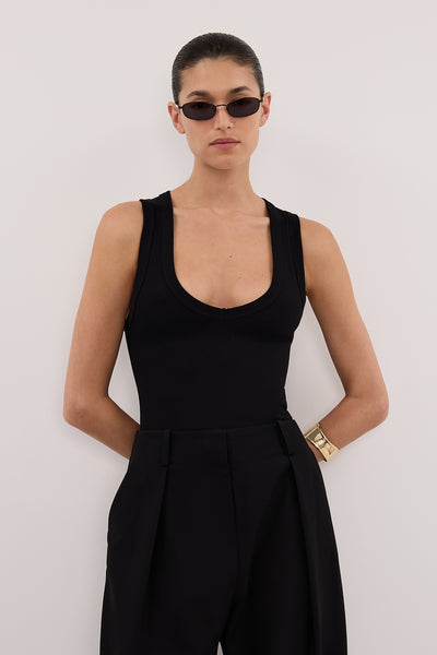 Aude wearing YASMIN BLACK SLEEVELESS KNIT TANK