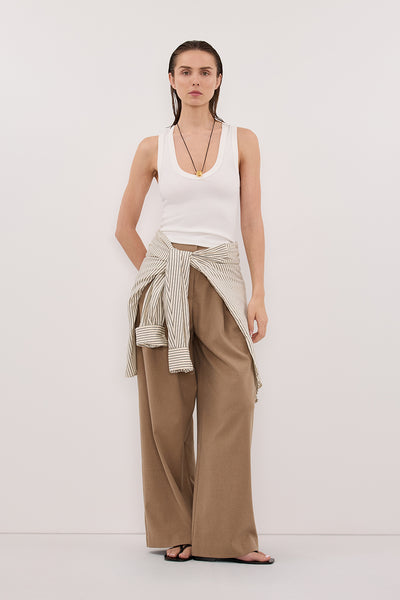 Stas wearing YASMIN OFF WHITE SLEEVELESS KNIT TANK