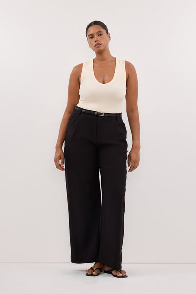Amanda wearing YASMIN SANDSTONE SLEEVELESS KNIT TANK