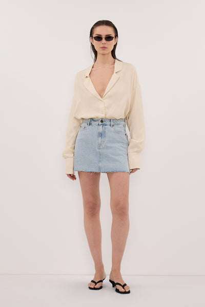 Stas wearing DANA LIGHT RINSE DENIM MINI SKIRT