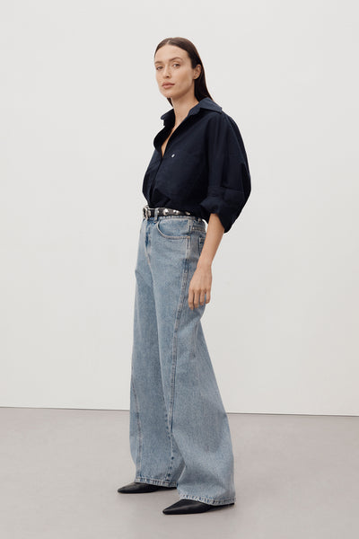 Casey wearing CARSON MID BLUE WIDE LEG JEAN