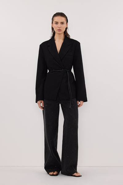 Stas wearing REAGAN 2.0 BLACK RINSE EYELET SLOUCHY JEAN