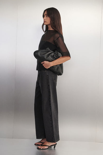 Holly wearing FRANK BLACK RINSE RELAXED JEAN