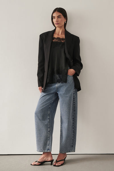 Holly wearing FRANK MID BLUE RELAXED JEAN