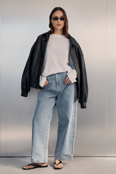 Casey wearing FRANK MID BLUE RELAXED JEAN