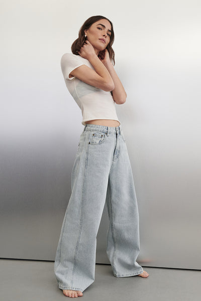 Bambi wearing DREW LIGHT RINSE WIDE LEG DENIM JEAN