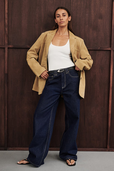 Dom wearing REAGAN 2.0 INDIGO SLOUCHY JEAN