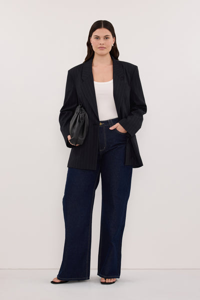 Jasmine wearing REAGAN 2.0 INDIGO SLOUCHY JEAN