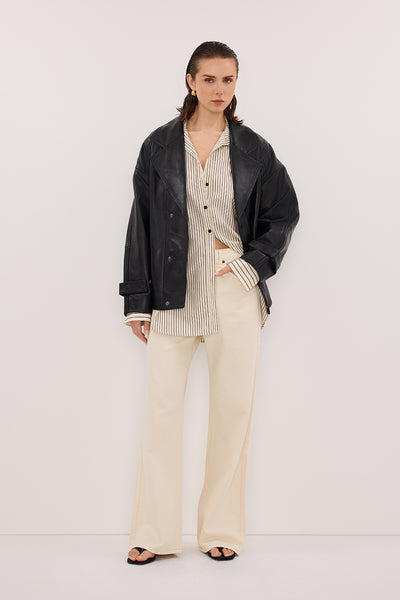 Stas wearing REAGAN 2.0 NATURAL SLOUCHY JEAN