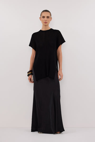 Stas wearing JADE BLACK SLEEVELESS KNIT TOP