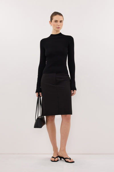 Stas wearing ANGEL BLACK RAGLAN FUNNEL NECK TOP