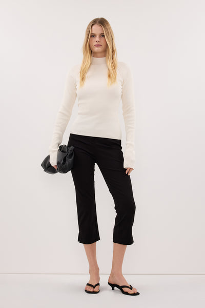Zoe wearing ANGEL CREAM RAGLAN FUNNEL NECK TOP