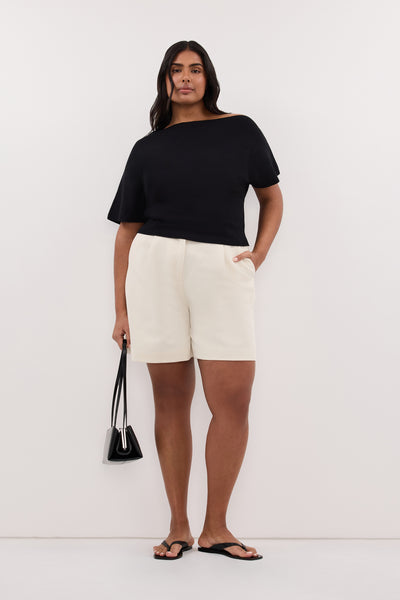 Shanaya wearing SCARLETT BLACK ASYM KNIT TOP
