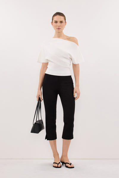 Stas wearing SCARLETT OFF WHITE ASYM KNIT TOP