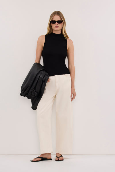 Zoe wearing ANGEL BLACK SLEEVELESS KNIT TOP