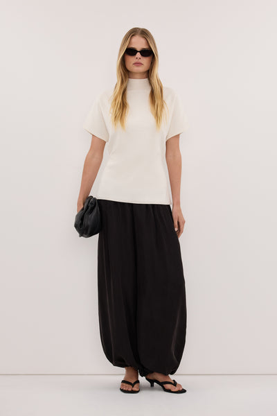 Zoe wearing DIANA OFF WHITE FUNNEL NECK TOP