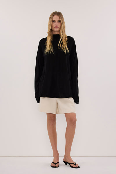 Zoe wearing VIRELLE BLACK MERINO KNIT TOP