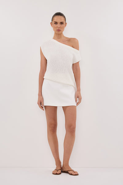 Stas wearing KERRY OFF WHITE ASYM KNIT TOP