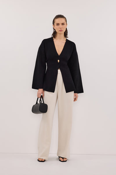 Stas wearing SCOUT BLACK LONG SLEEVE KNIT TOP