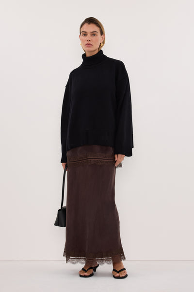 Joanna wearing ELLA BLACK TURNBACK NECK KNIT JUMPER