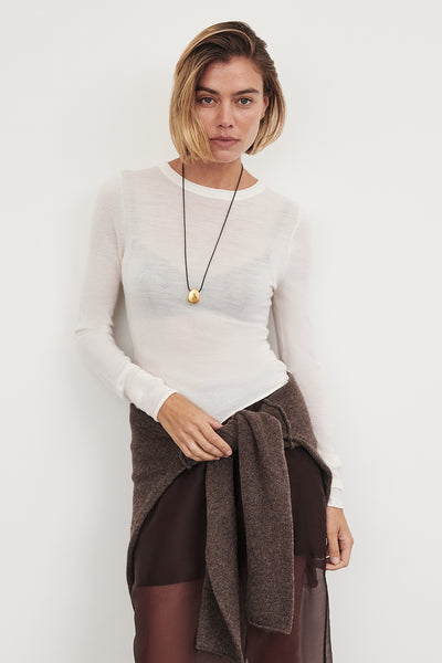 Joanna wearing DUKE OFF WHITE LONG SLEEVE MERINO KNIT TOP