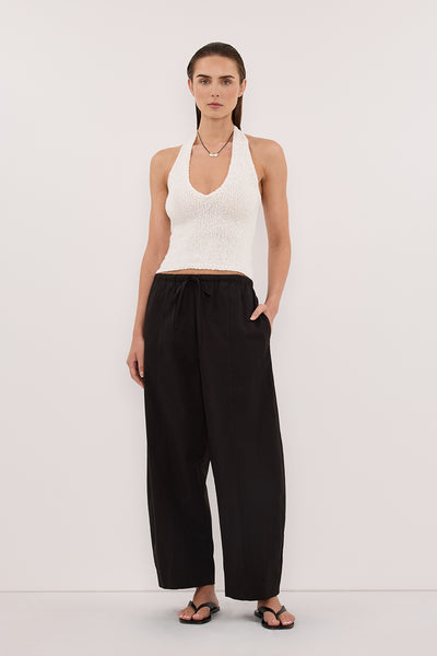 Stas wearing DINA OFF WHITE SLEEVELESS HALTER KNIT TOP
