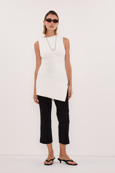 Aude wearing CLEO WHITE SLEEVELESS LONGLINE KNIT TOP 
