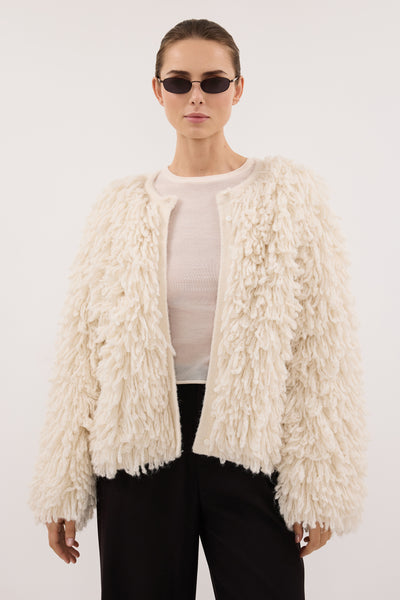 Stas wearing LANA CREAM LONGLINE KNIT CARDIGAN