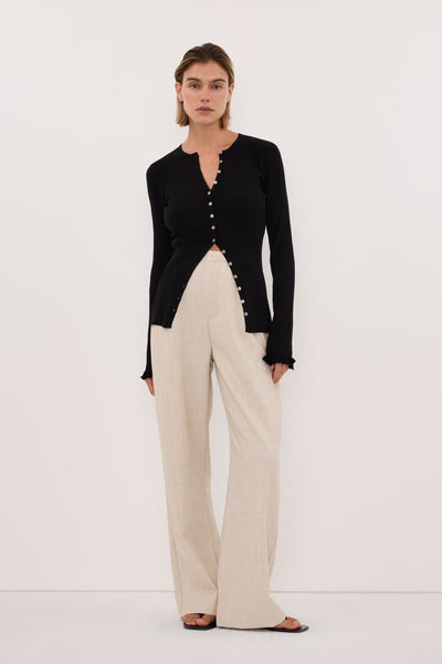 Joanna wearing KAIA BLACK RUFFLE KNIT CARDIGAN
