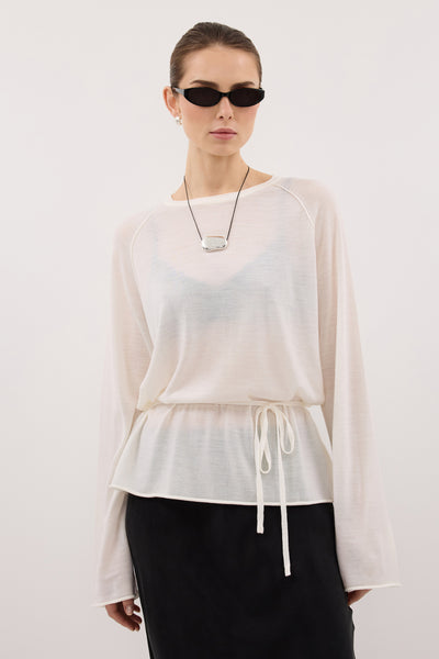 Stas wearing DUKE OFF WHITE TIE MERINO KNIT TOP