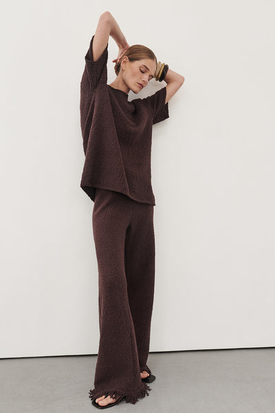Elena wearing SUE CHOC FRINGE KNIT PANT