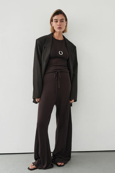 Joanna wearing DUKE BITTER CHOC MERINO KNIT PANTS