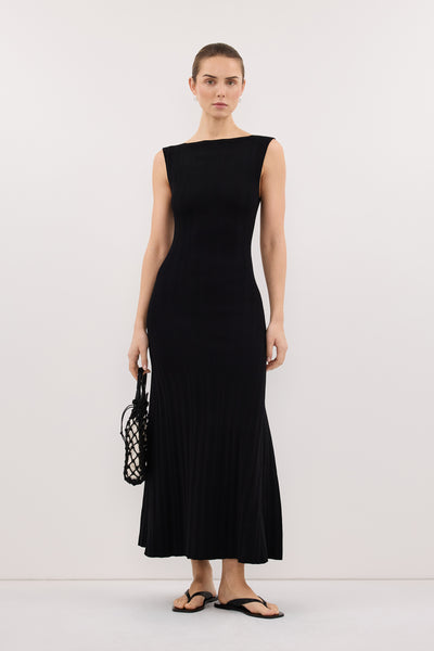 Stas wearing DOVE BLACK SLEEVELESS RIBBED KNIT MAXI DRESS